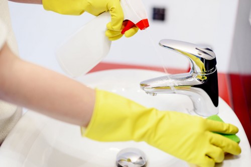 End of tenancy cleaner working with floor safety precautions