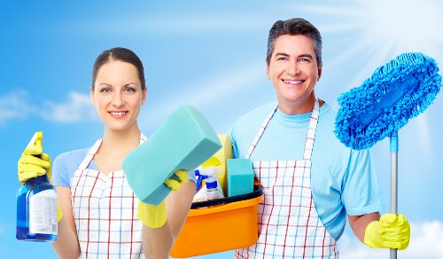Cleaning staff using safe product handling and protective equipment